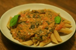 Penne with creamy tomato, spinach, and seitan sauce